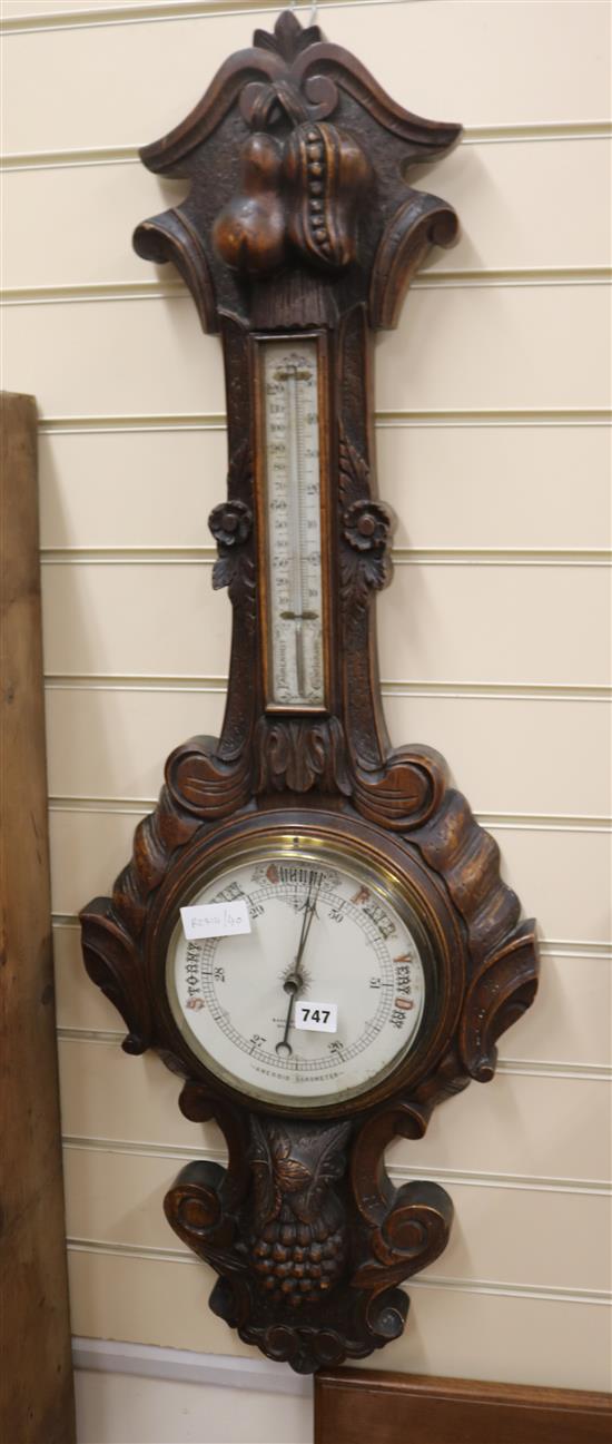 A Victorian carved oak wheel barometer, H.107cm